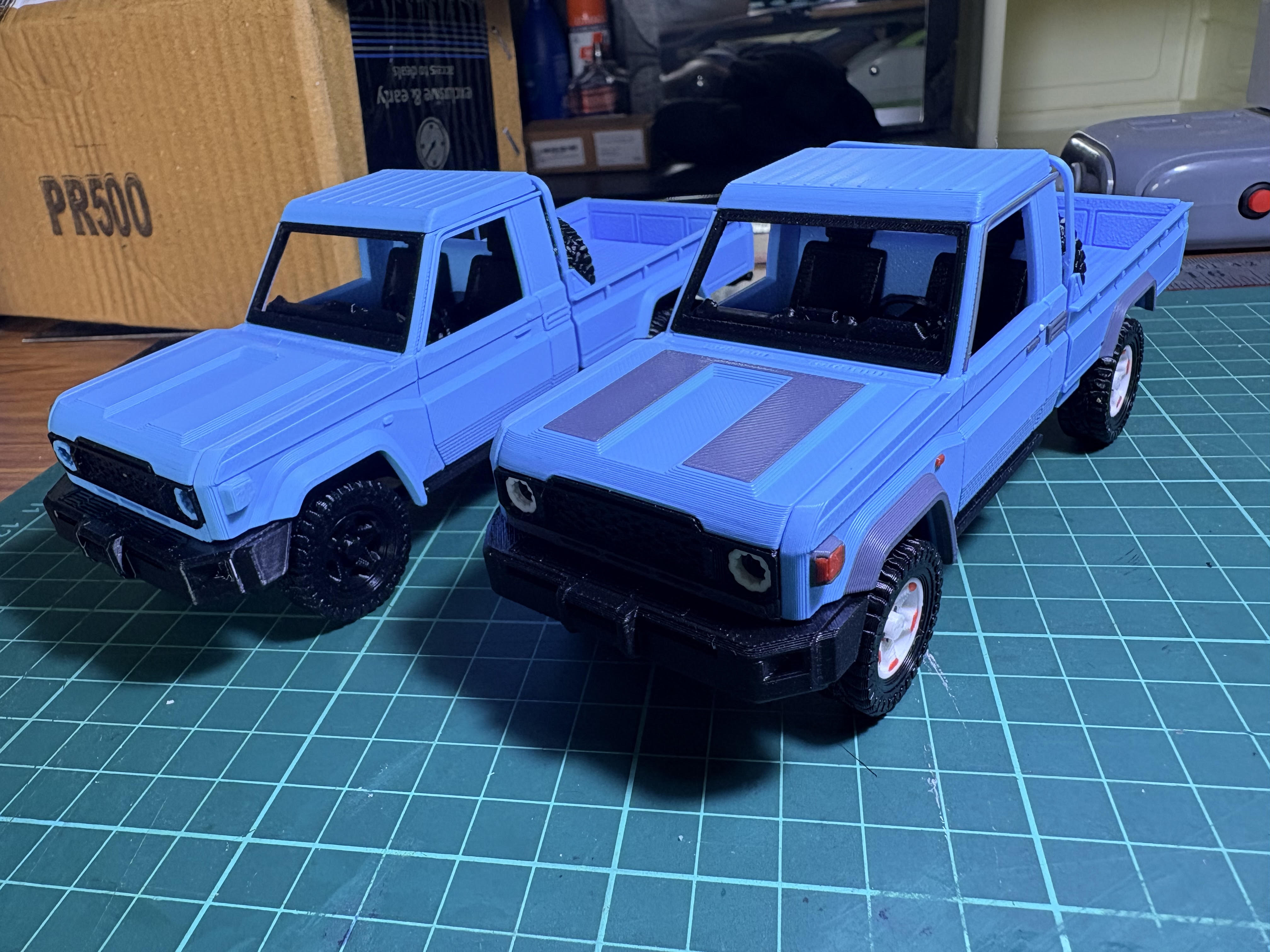 Two blue custom scale-model vehicles